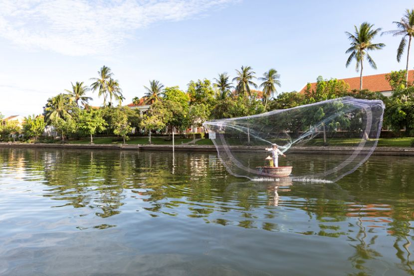Fishing on the bank of river in Hoi An Ancient Town