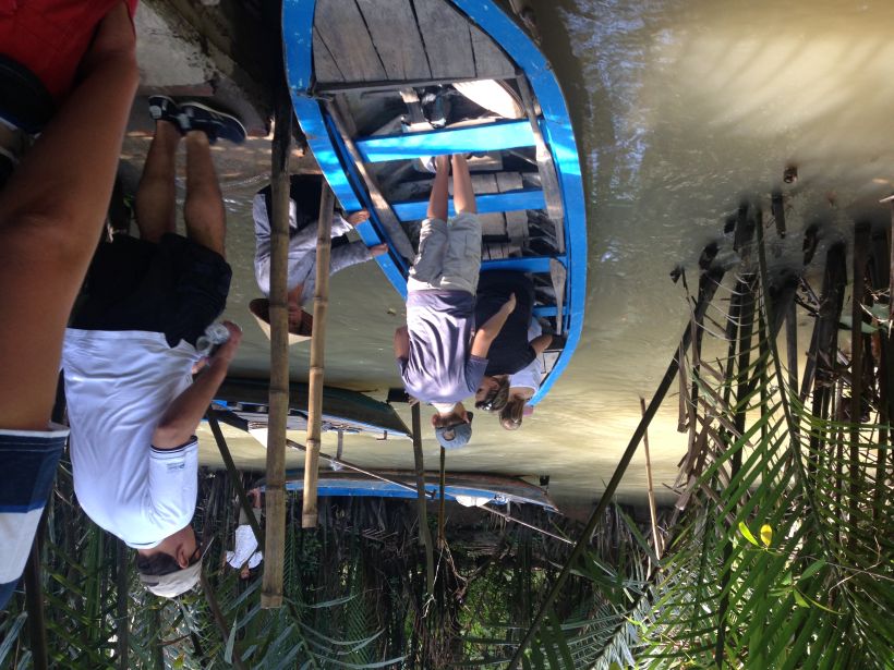 Rowing boat in Ben Tre canals